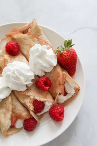 Ingredients:

1 cup all-purpose flour
2 tablespoons granulated sugar
2 teaspoons baking powder
1/4 teaspoon salt
1 cup milk
1 large egg
2 tablespoons unsalted butter, melted
1/2 teaspoon vanilla extract
1 cup fresh strawberries, hulled and chopped
Additional sliced strawberries for serving (optional)
Maple syrup or whipped cream for serving (optional)

Instructions:

In a large mixing bowl, whisk together the flour, sugar, baking powder, and salt.

In a separate bowl, whisk together the milk, egg, melted butter, and vanilla extract.

Add the wet ingredients to the dry ingredients and stir until just combined. Do not overmix, as it can result in tough pancakes.

Gently fold in the chopped strawberries.

Heat a griddle or non-stick skillet over medium heat and lightly grease with cooking spray or additional melted butter.

Using a 1/4-cup measuring cup, pour the batter onto the hot griddle or skillet. Cook until bubbles form on the surface of the pancake, then flip and cook for an additional 1-2 minutes, or until lightly golden brown.

Repeat with the remaining batter, adding more butter or cooking spray as needed.

Serve the strawberry pancakes hot, topped with additional sliced strawberries, maple syrup, or whipped cream, if desired.

Enjoy these delicious and fluffy strawberry pancakes as a sweet breakfast treat or brunch option! Happy cooking!
